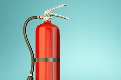 Fire Extinguisher Against A Green Background Thumb 